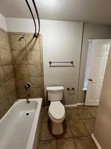 a bathroom with a toilet sink and a shower