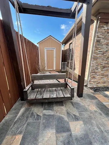 a view of a balcony with furniture