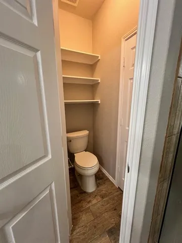 a bathroom with a toilet and a sink