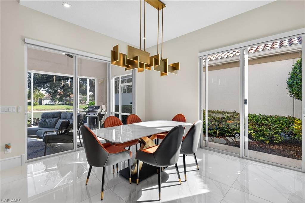 3956 Isla Ciudad Court Naples, FL 34109 - Photo 12 of 39 Dining space with marble tiled floors