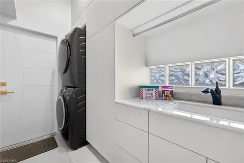 a kitchen with a refrigerator and a sink