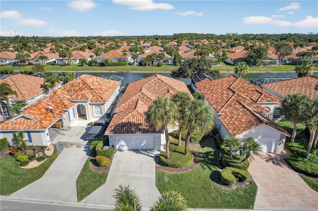 3956 Isla Ciudad Court Naples, FL 34109 - Photo 33 of 39 Aerial perspective of suburban area featuring a large body of water