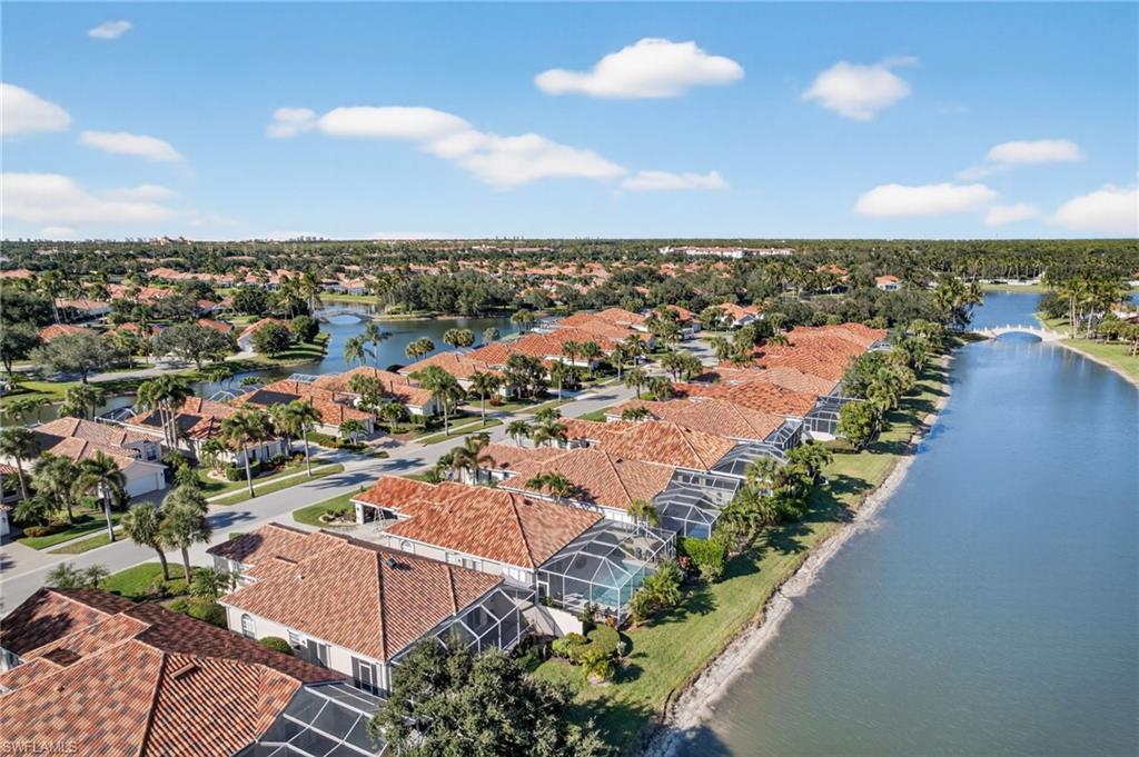 3956 Isla Ciudad Court Naples, FL 34109 - Photo 35 of 39 Aerial perspective of suburban area featuring a large body of water