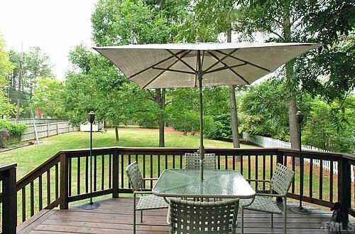 405 Maylands Avenue Raleigh, NC 27615 - Photo 9 of 10 Largest mature and private lot w. great shade from Magnolia, Holly trees, Maples. Romantic 'canapy' over deck perfect for entertaining. Deck has been stained and has brick walkway around side of house.