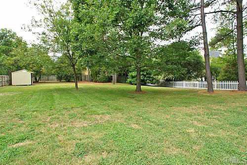 405 Maylands Avenue Raleigh, NC 27615 - Photo 10 of 10 Can you believe the size of this yard? All flat with hardwood trees, completely fenced on all sides and with a storage shed at back of yard for lawn equipment.