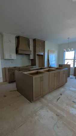 a kitchen that has a sink and a stove