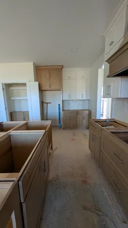 a kitchen with a sink and cabinets