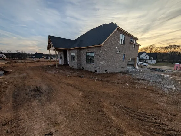 a big house with yard in front of it