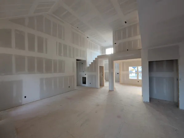 a view of empty room with windows