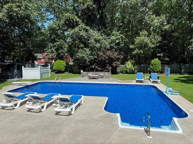 a view of swimming pool with seating space