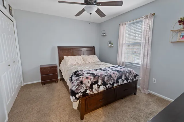 a bedroom with a bed furniture and a window