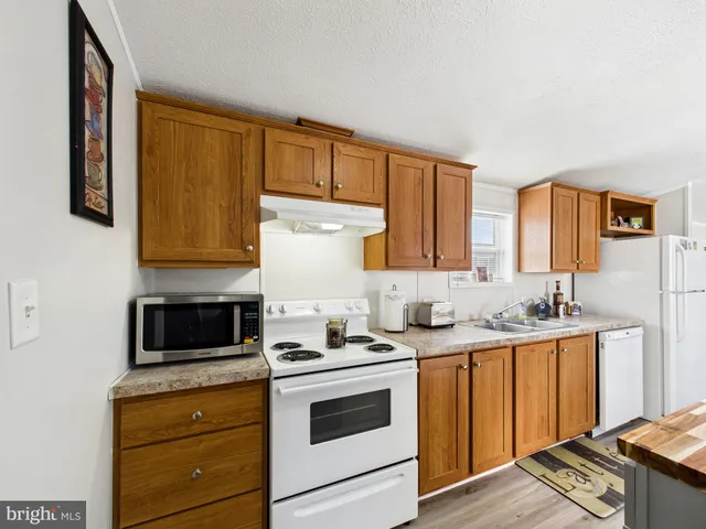a kitchen with a stove and a microwave