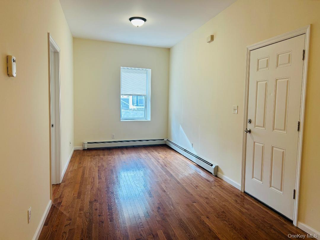 16 Schneider Avenue, Unit 1 Highland Falls, NY 10928 - Photo 3 of 6 a view of an empty room with wooden floor and a window