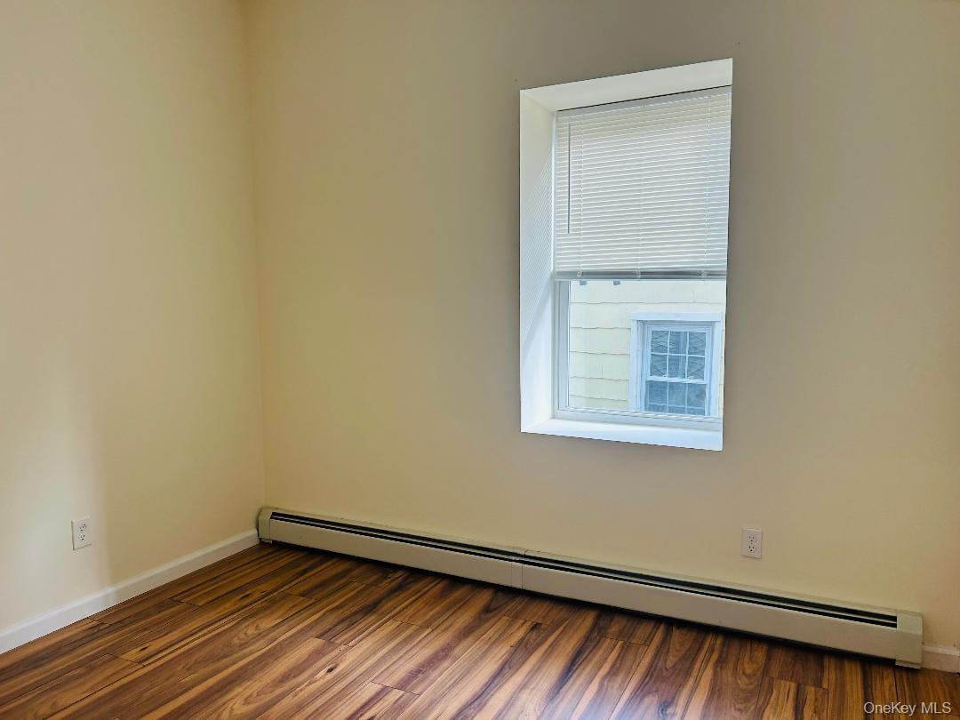 16 Schneider Avenue, Unit 1 Highland Falls, NY 10928 - Photo 4 of 6 a view of an empty room with wooden floor and a window