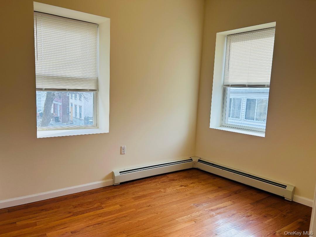 16 Schneider Avenue, Unit 1 Highland Falls, NY 10928 - Photo 6 of 6 a view of an empty room with wooden floor and a window