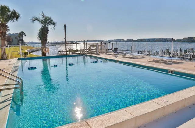 a view of a swimming pool with a lawn chairs