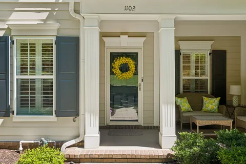 a front view of a house with a porch