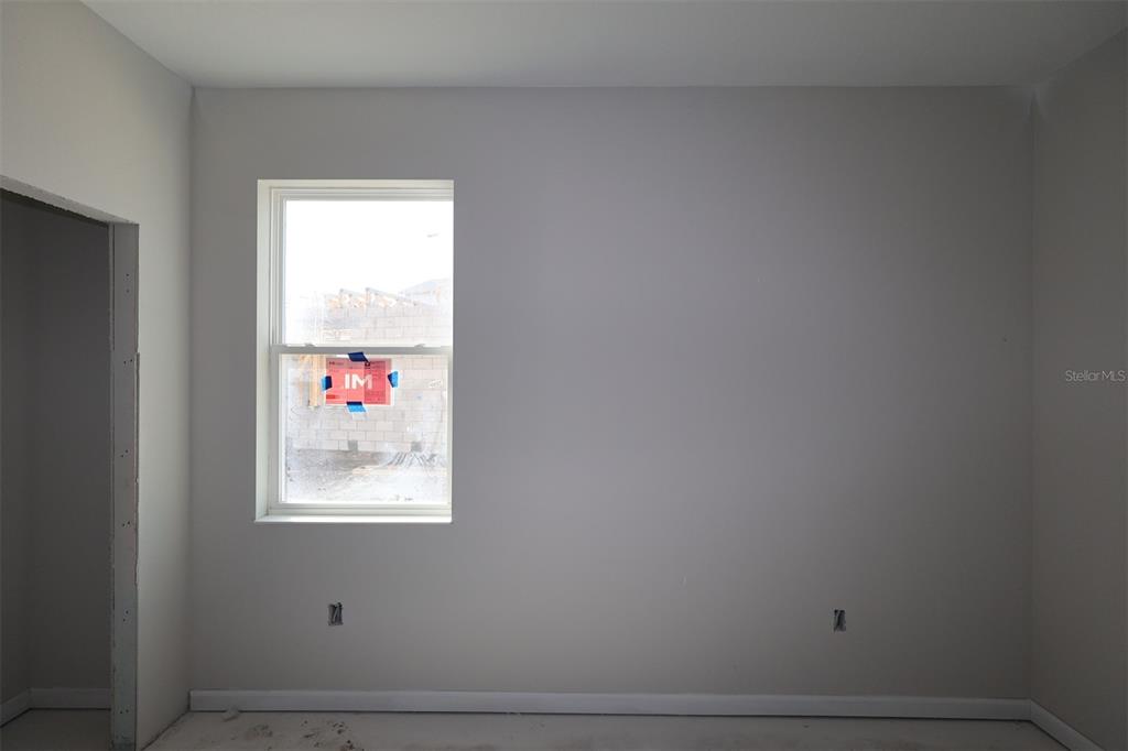 5348 Ctr Lk Rnch Boulevard St. Cloud, FL 34771 - Photo 13 of 19 a room with cabinet and a window