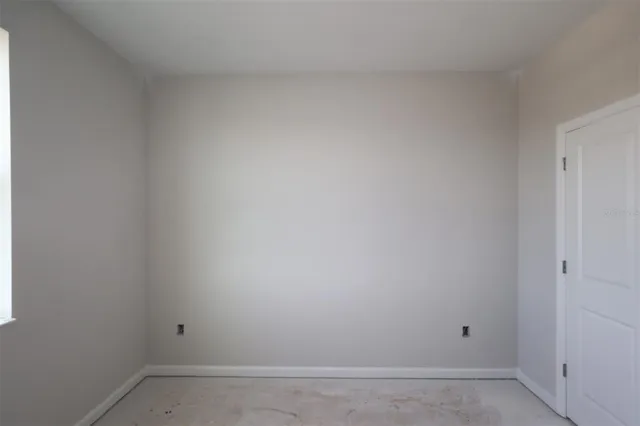 a room with cabinet and a window