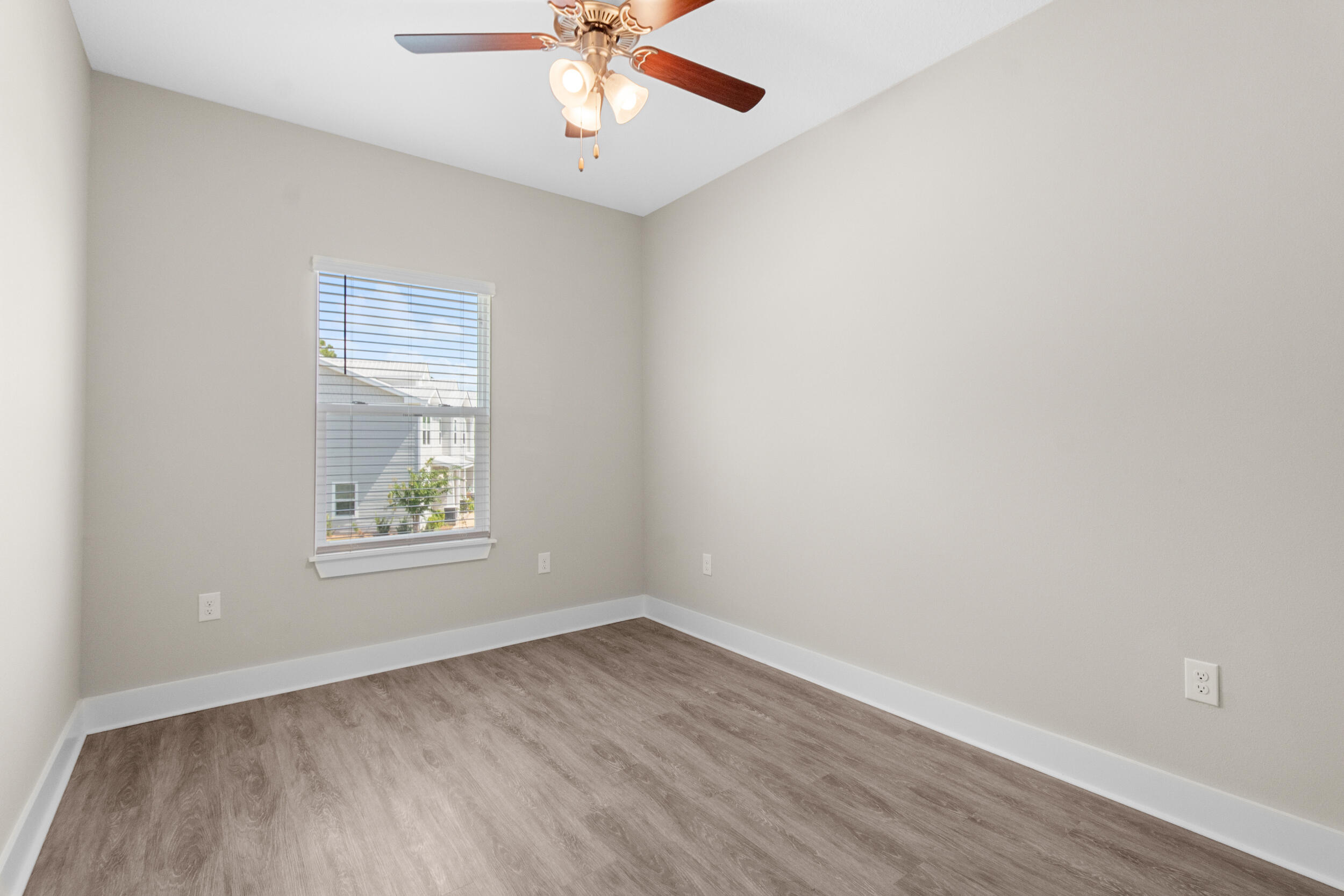 280 Date Palm Lane Freeport, FL 32439 - Photo 14 of 39 an empty room with a window and a ceiling fan