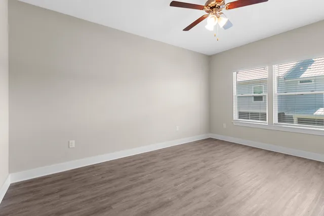 a bathroom with a shower sink vanity granite and mirror