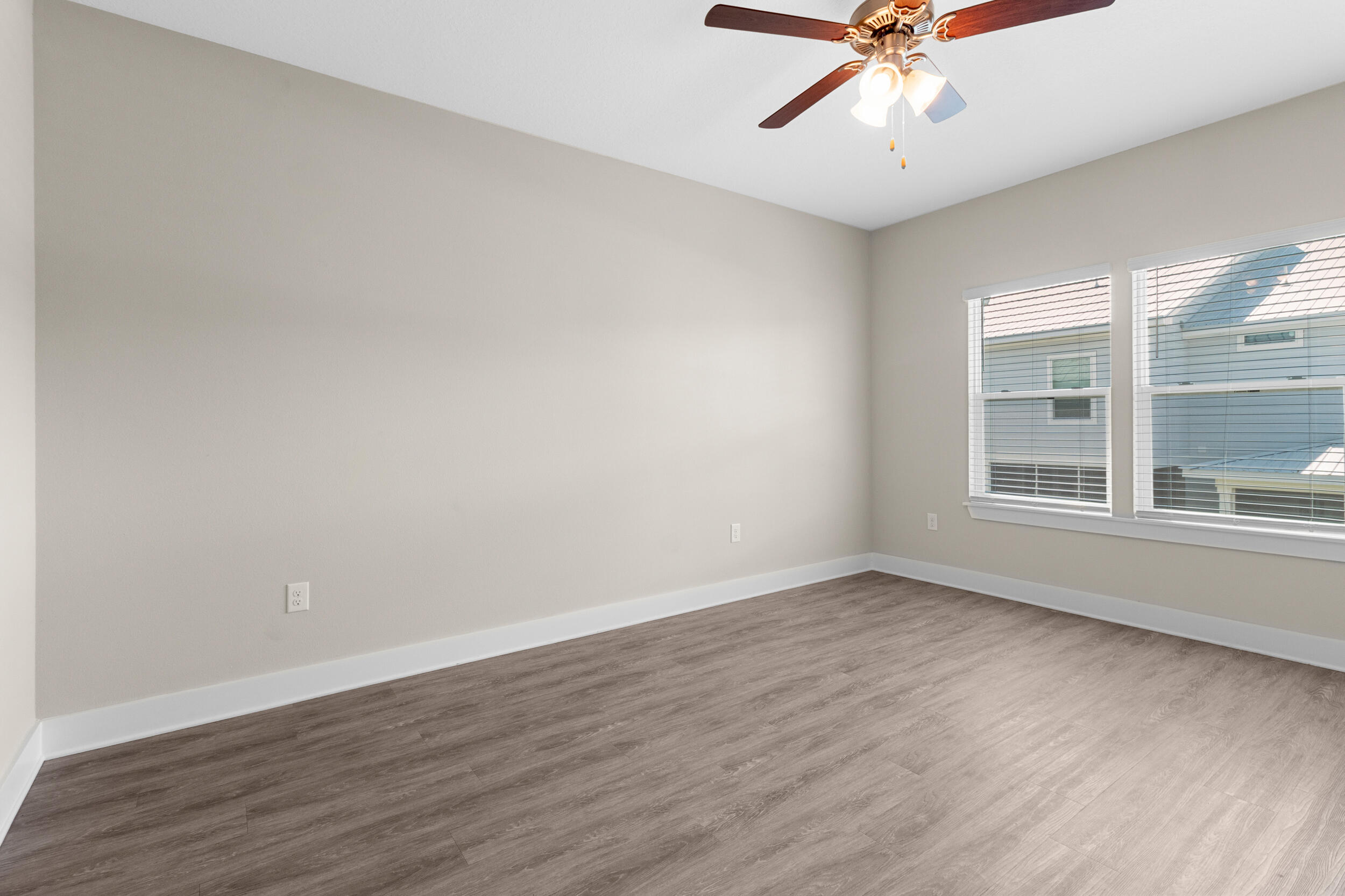280 Date Palm Lane Freeport, FL 32439 - Photo 18 of 39 wooden floor in an empty room with a window