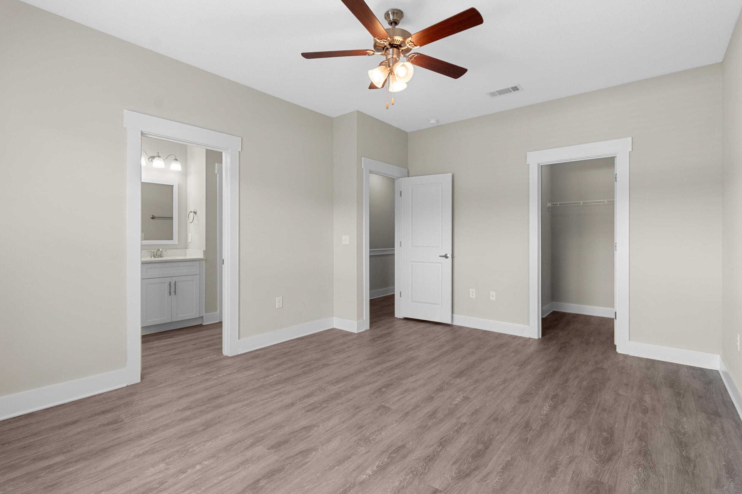 280 Date Palm Lane Freeport, FL 32439 - Photo 20 of 39 an empty room with wooden floor and windows