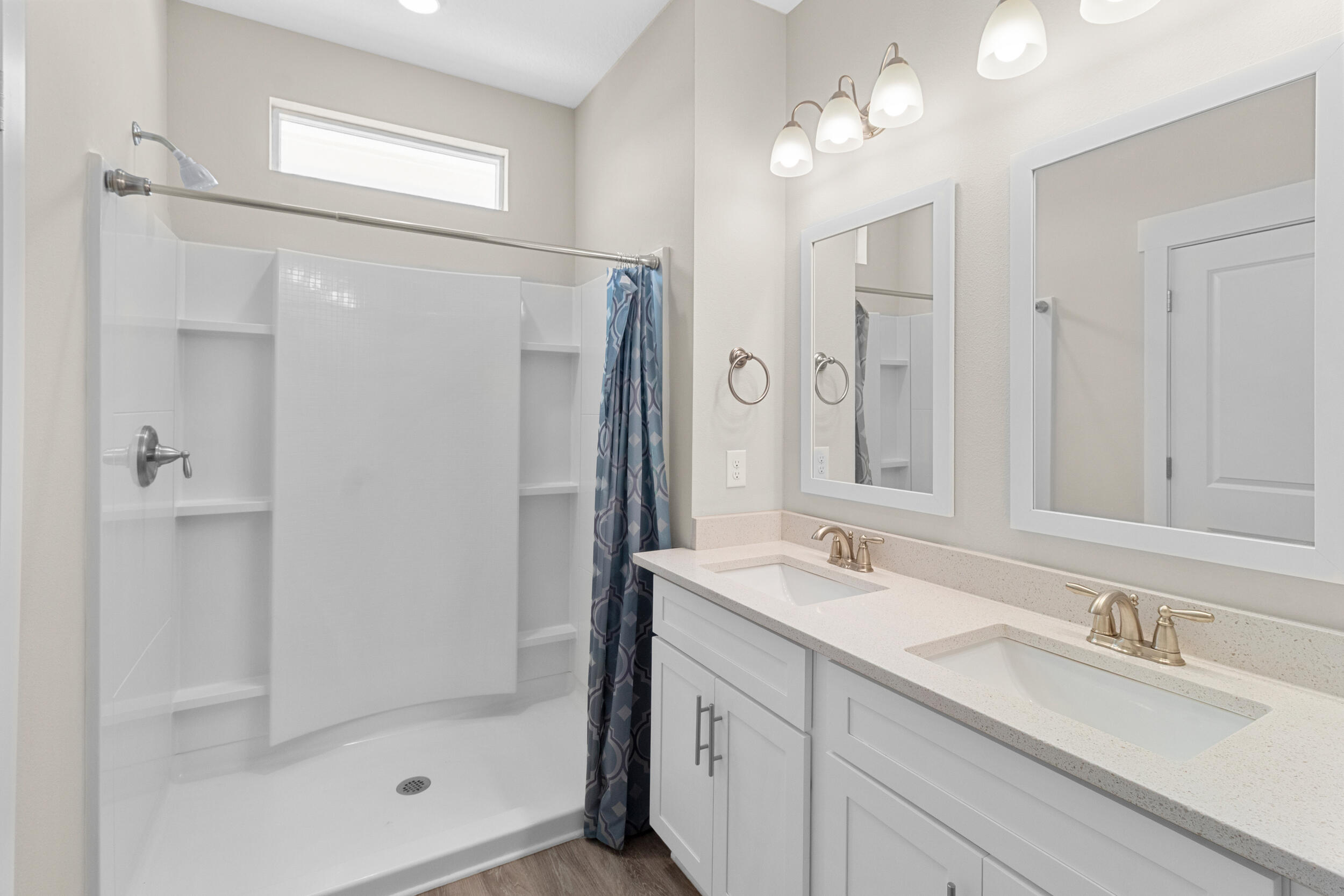 280 Date Palm Lane Freeport, FL 32439 - Photo 22 of 39 a bathroom with a shower sink vanity granite and mirror