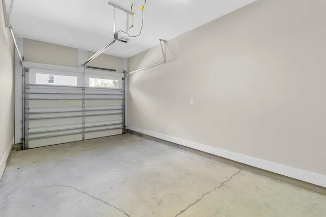 a view of a house with swimming pool and sitting area