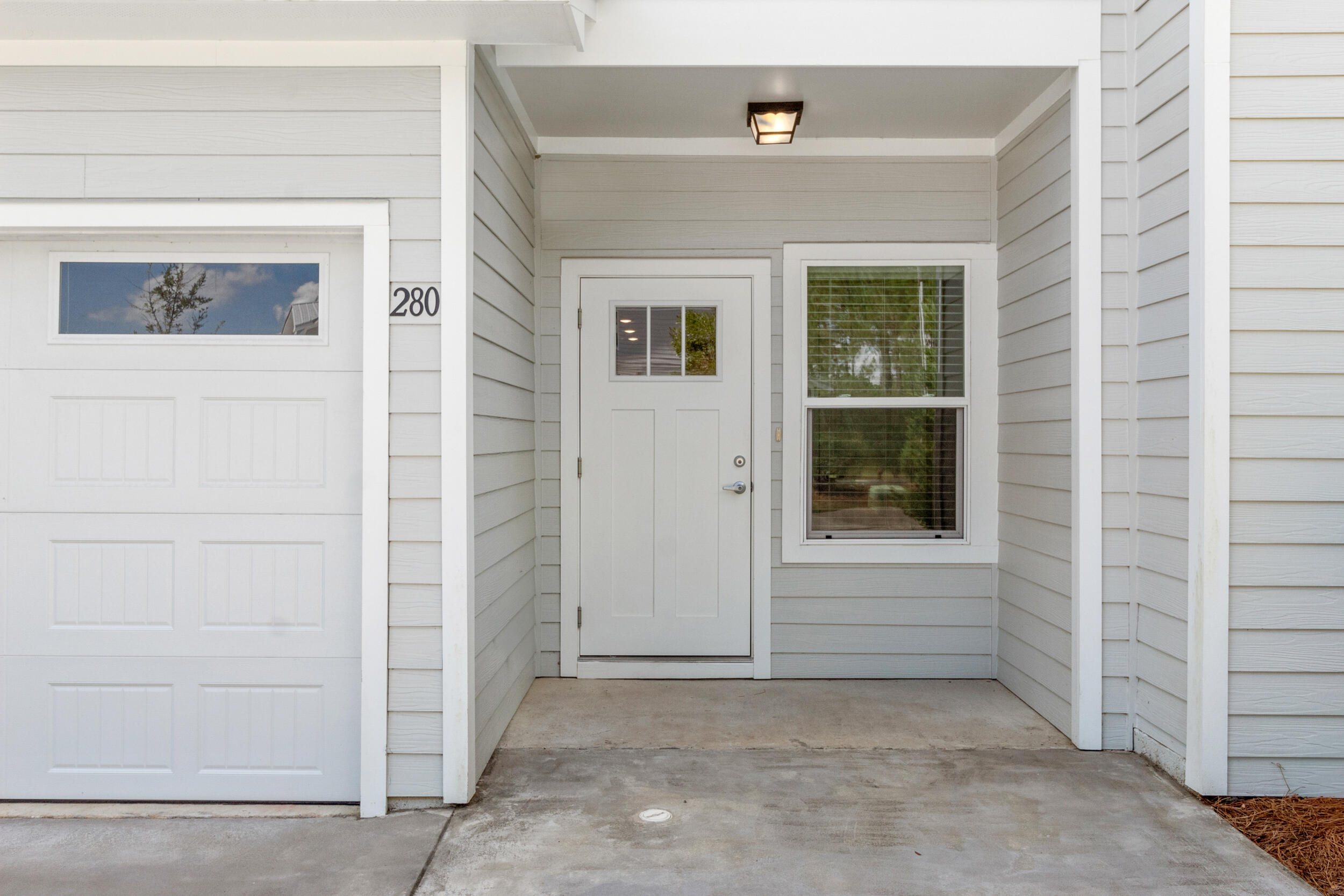 280 Date Palm Lane Freeport, FL 32439 - Photo 3 of 39 a view of front door and a window