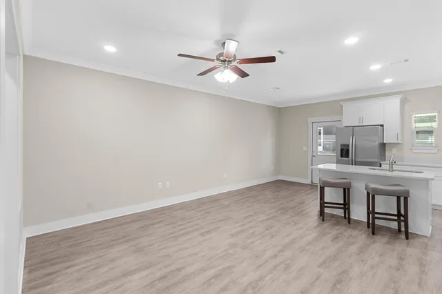 a view of workspace with wooden floor and window