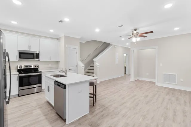 a kitchen with a stove and a microwave