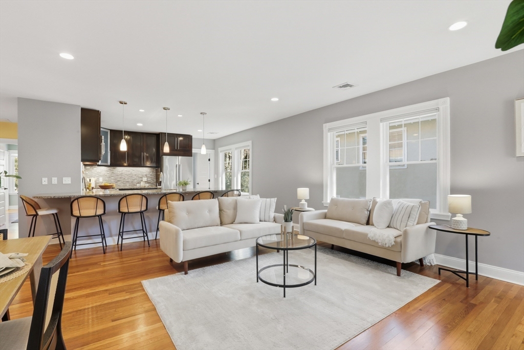16 Park Avenue, Unit 2 Winchester, MA 01890 - Photo 4 of 32 a living room with furniture and a wooden floor