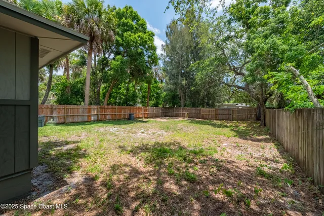 a view of outdoor space with deck and yard