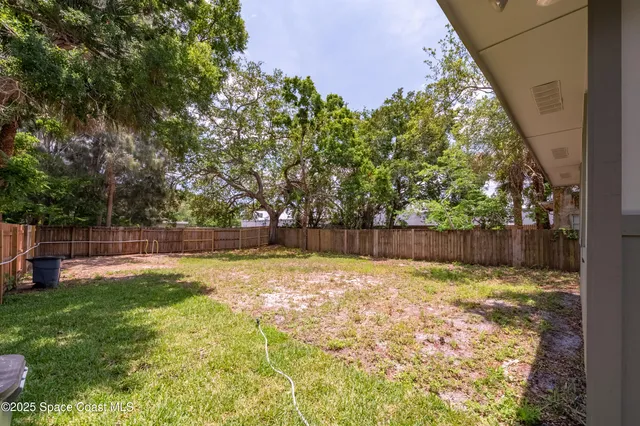 a view of a backyard with a small cabin