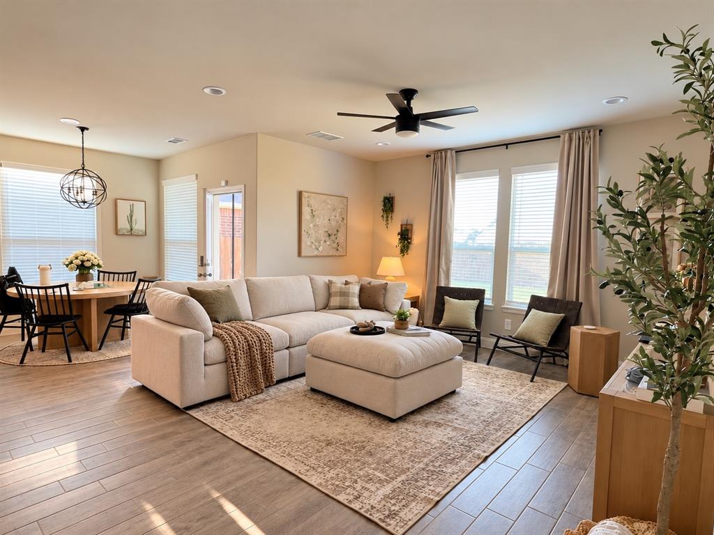 1605 Buzzard Road Denton, TX 76205 - Photo 6 of 27 Open-concept living space with wood-finish flooring, recessed lighting, and a modern ceiling fan