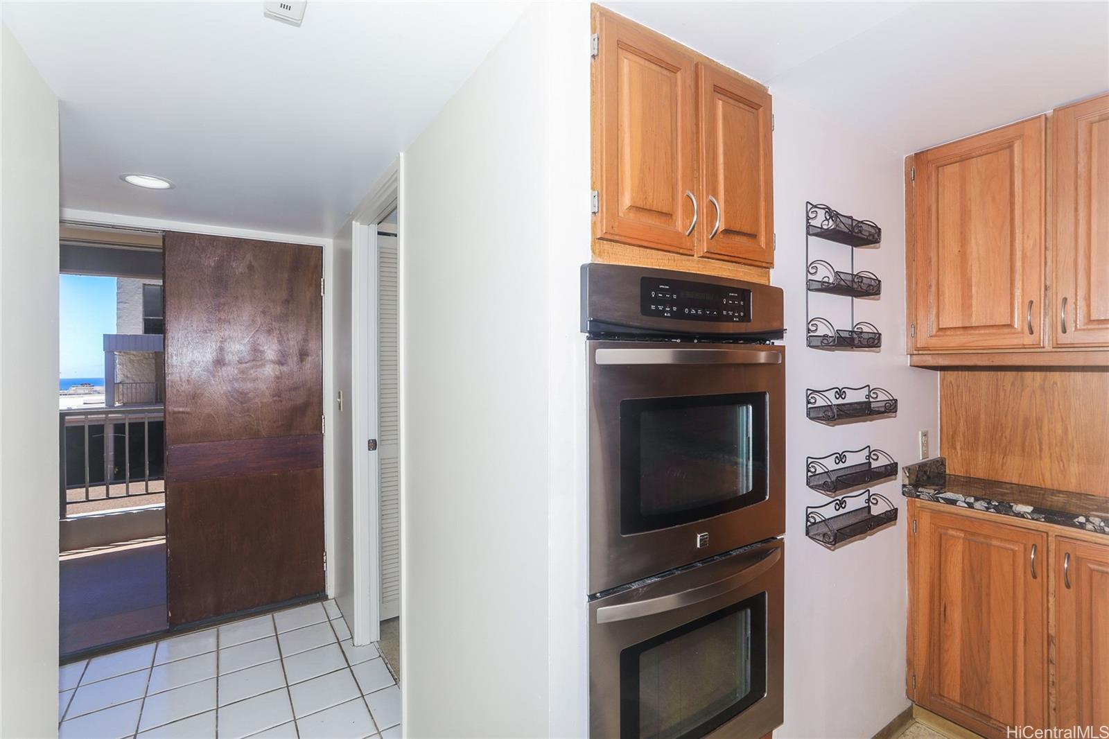 217 Prospect Street, Unit 101 Honolulu, HI 96813 - Photo 12 of 25 a kitchen with granite countertop stainless steel appliances and counter space