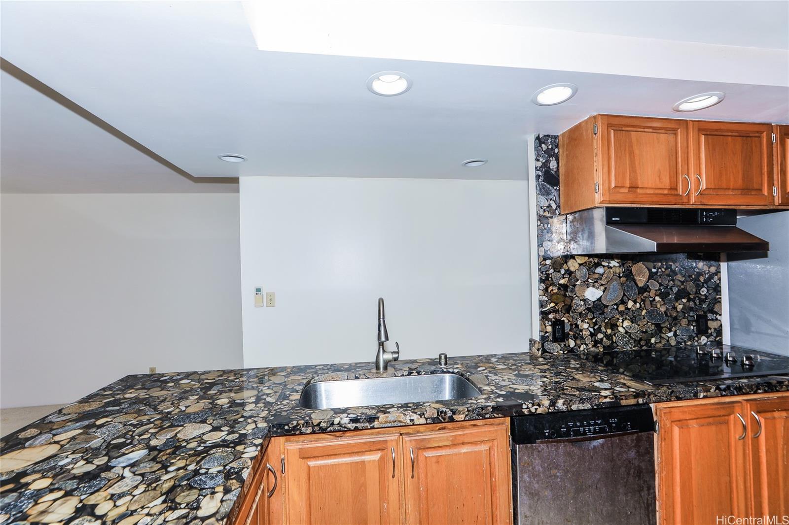 217 Prospect Street, Unit 101 Honolulu, HI 96813 - Photo 9 of 25 a kitchen with stainless steel appliances granite countertop a sink and a stove