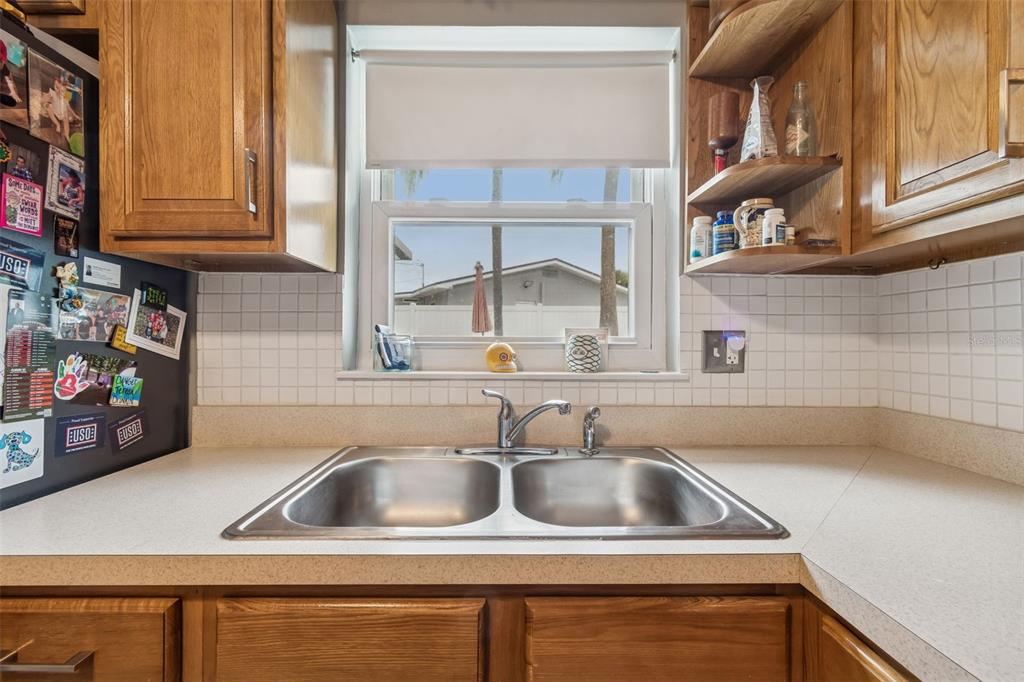 12424 105th Street Largo, FL 33773 - Photo 11 of 45 a view closed with kitchen and stainless steel appliances