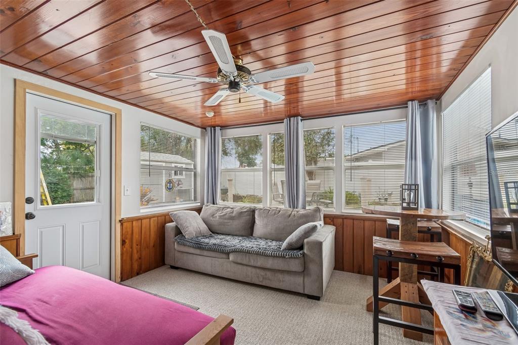 12424 105th Street Largo, FL 33773 - Photo 12 of 45 a living room with furniture and a large window
