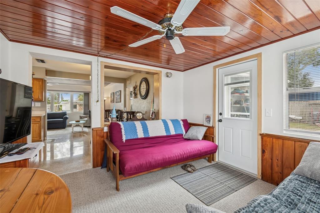 12424 105th Street Largo, FL 33773 - Photo 14 of 45 a bedroom with furniture and a flat screen tv