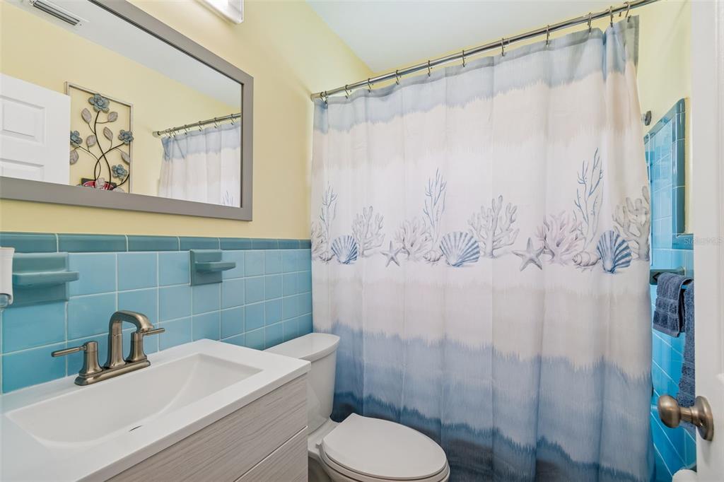 12424 105th Street Largo, FL 33773 - Photo 19 of 45 a bathroom with a sink toilet and shower
