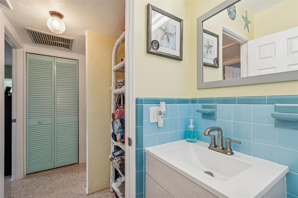 12424 105th Street Largo, FL 33773 - Photo 20 of 45 a bathroom with a sink and a mirror