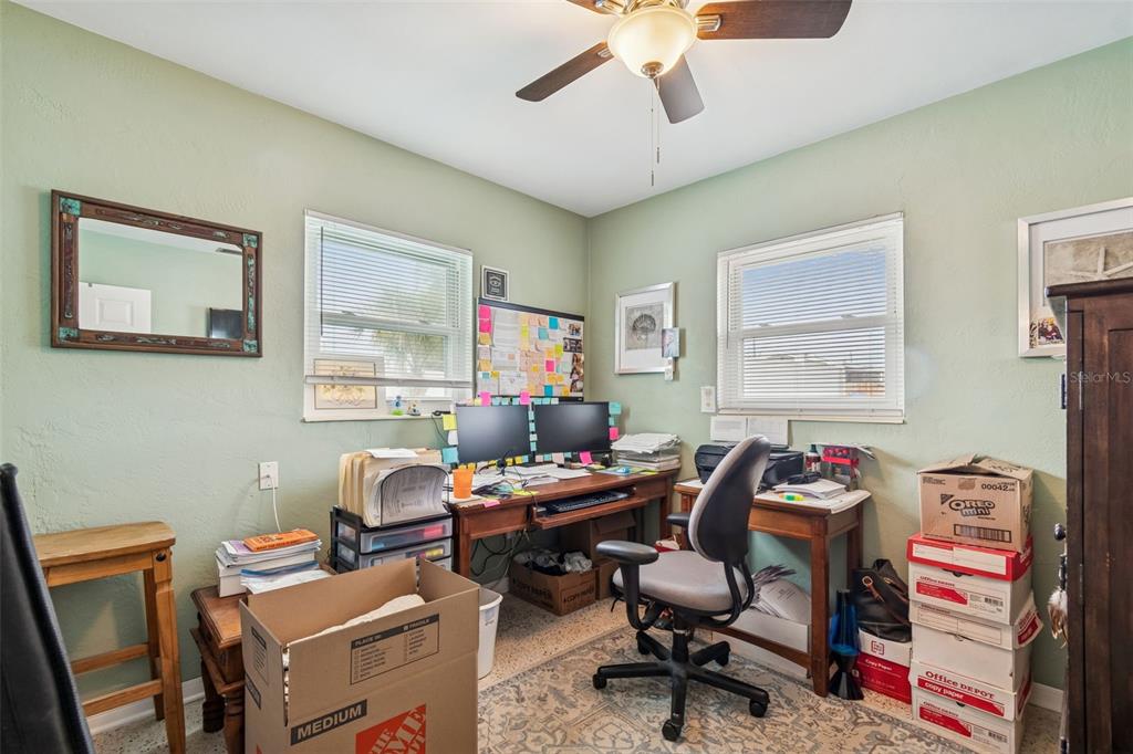 12424 105th Street Largo, FL 33773 - Photo 22 of 45 a room with furniture a rug and a window