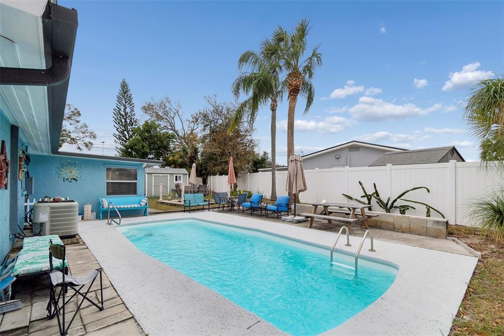 12424 105th Street Largo, FL 33773 - Photo 34 of 45 swimming pool with outdoor seating