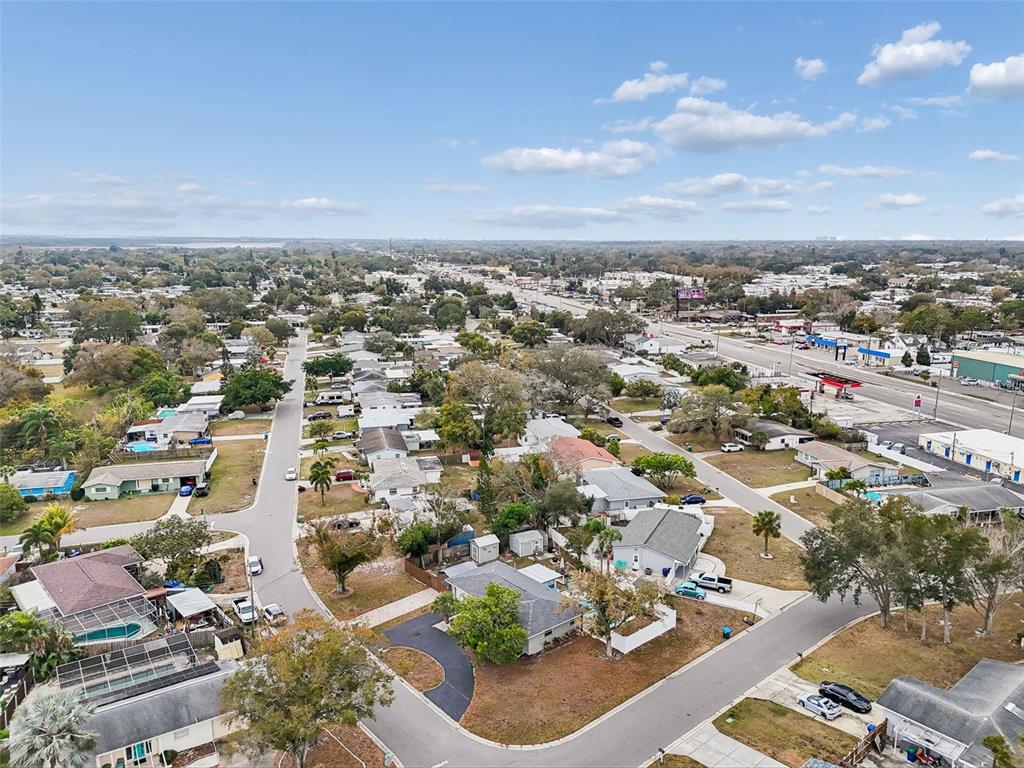 12424 105th Street Largo, FL 33773 - Photo 43 of 45 an aerial view of residential building with green space