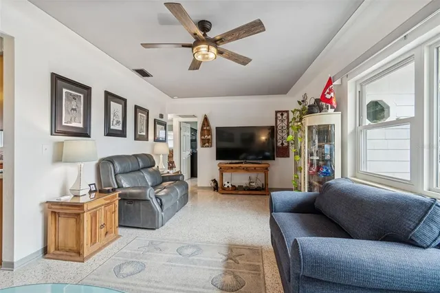 a living room with furniture workspace and a window