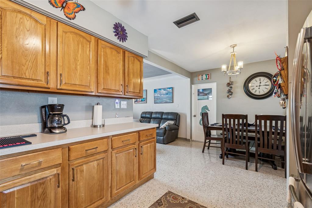 12424 105th Street Largo, FL 33773 - Photo 10 of 45 a kitchen with a cabinets and furniture