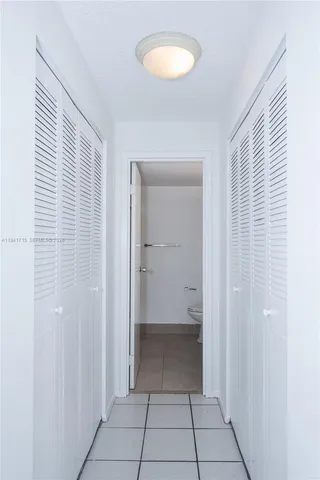 a view of a room with a door and a sink