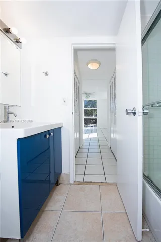 a bathroom with a vanity and a mirror